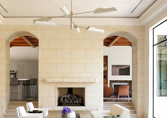 Stone fireplace in a Bob Thompson living room